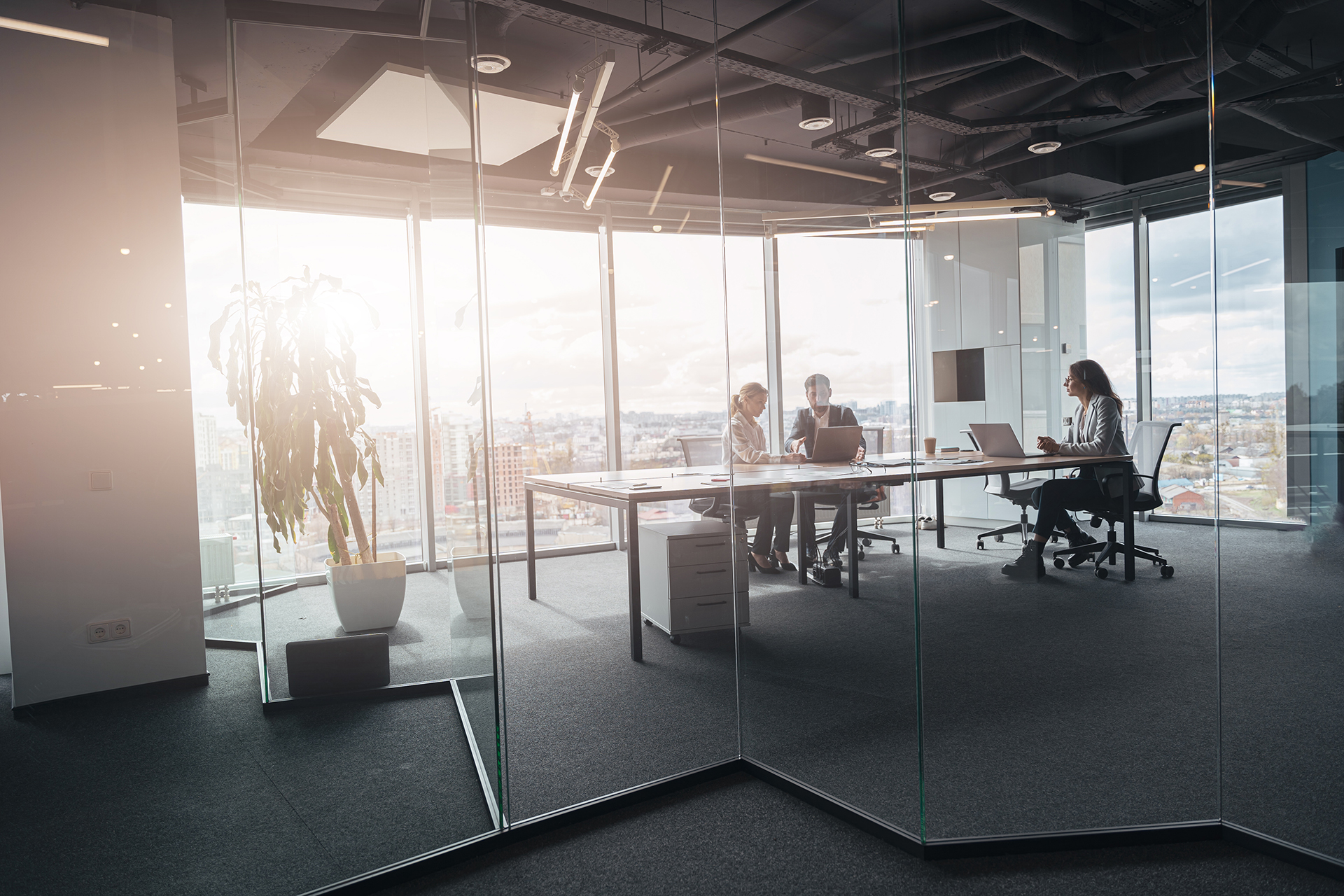 creative business people working on project in modern office with panoramic view